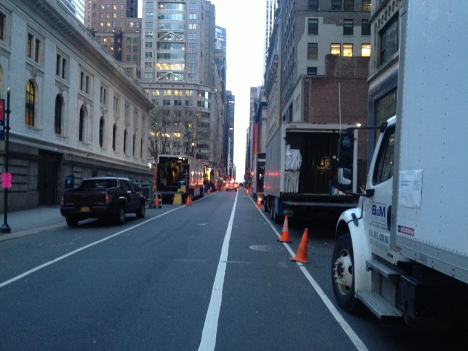 Part of a line of film crew trucks along 40th Street between 5th and 6th Avenues in Manhattan on the south side of Bryant Park.