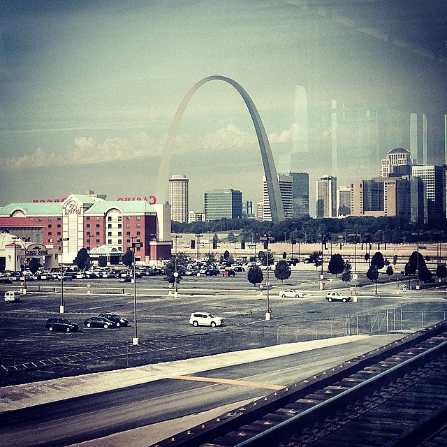 A view of the Gateway Arch from the Metrolink going over the historic Eads Bridge over the Mississippi River at St. Louis, Missouri.